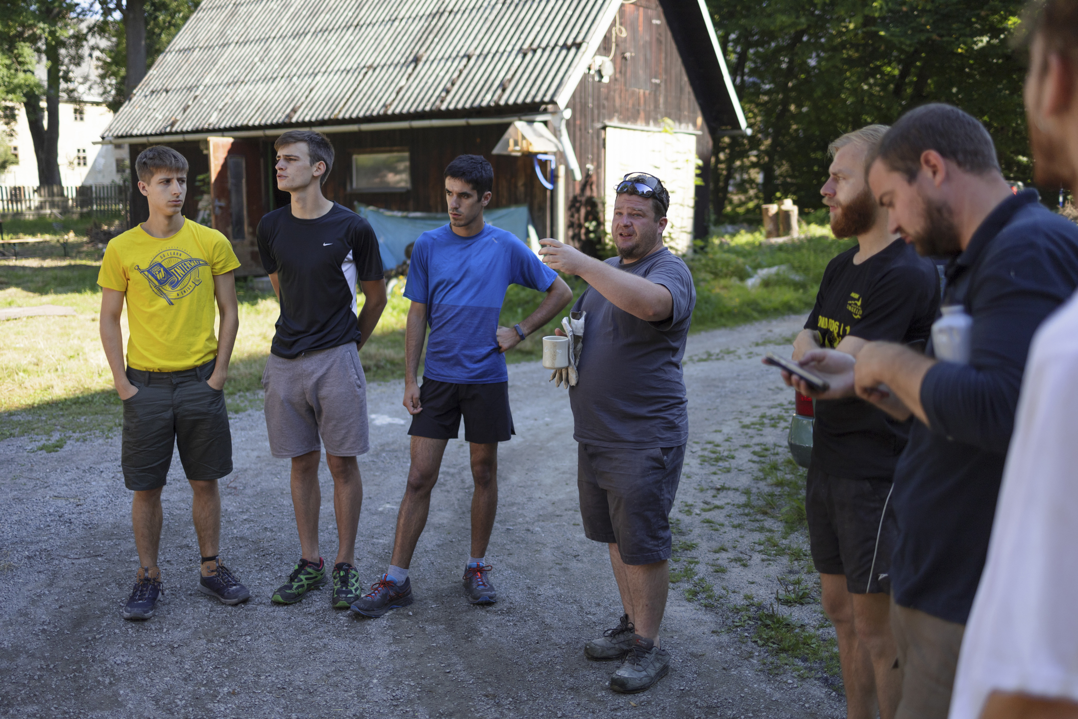 Briefing, Jakub Kříž, head of the Association for the Renovation of the Brewery in Janovice, is giving instructions to volunteers in the morning, Janovice, Rýmařov, Czech Republic